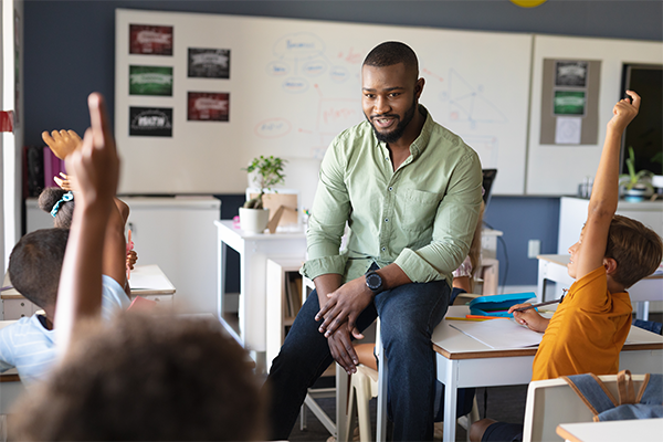 About the Program - Teacher in classroom with students