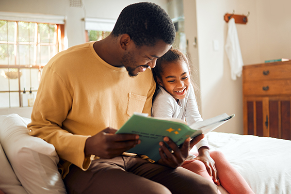 father and daughter reading