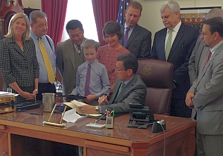 Ceremonial signign of Special Act 14-3